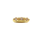 19K Gold ring with embedded diamonds on a white background
