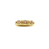 19K Gold ring with embedded diamonds on a white background