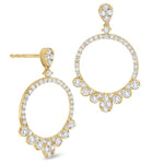 A pair of 14K yellow gold diamond drops earrings with multiple diamonds arranged in a circular pattern with a hoop design.