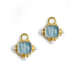 Gold, blue, and pearl jewelry with elegant design.