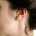 19K Gold sun-shaped earring with diamonds designed by Elizabeth Locke