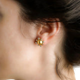 19K Gold sun-shaped earring with diamonds designed by Elizabeth Locke