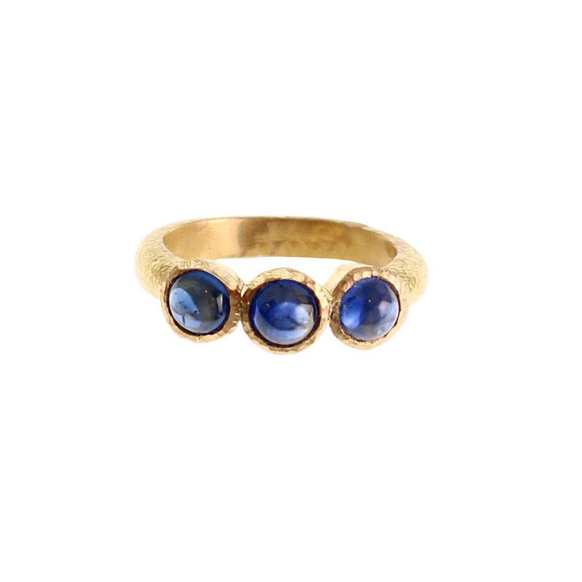 19K Gold ring with three blue sapphire gemstones on a white background