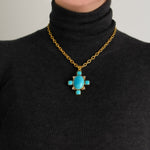 Elizabeth Locke Turquoise pendant necklace on a black turtleneck