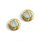 A pair of 19K yellow gold round stud earrings featuring a central milky white cabochon surrounded by four small light blue square crystals on a white background.