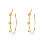 A pair of Estate 18K yellow gold hoop earrings with diamond accents.