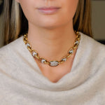 woman wearing an Estate 18K Gold Oval Link Necklace with Diamonds