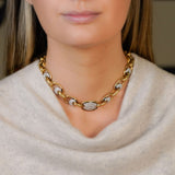 woman wearing an Estate 18K Gold Oval Link Necklace with Diamonds
