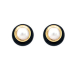 Pair of Estate earrings with black and gold circular design with large center Pearls on a white background 