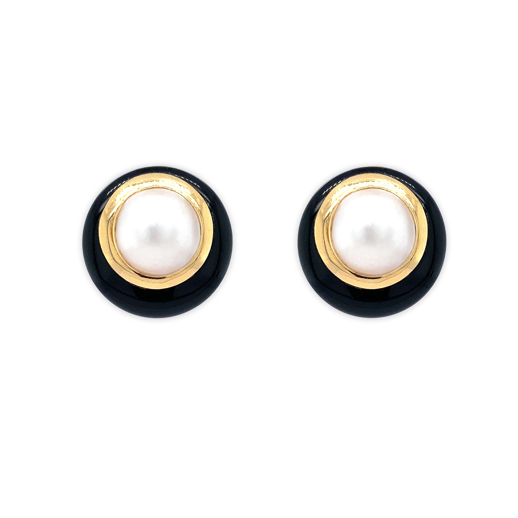 Pair of Estate earrings with black and gold circular design with large center Pearls on a white background 