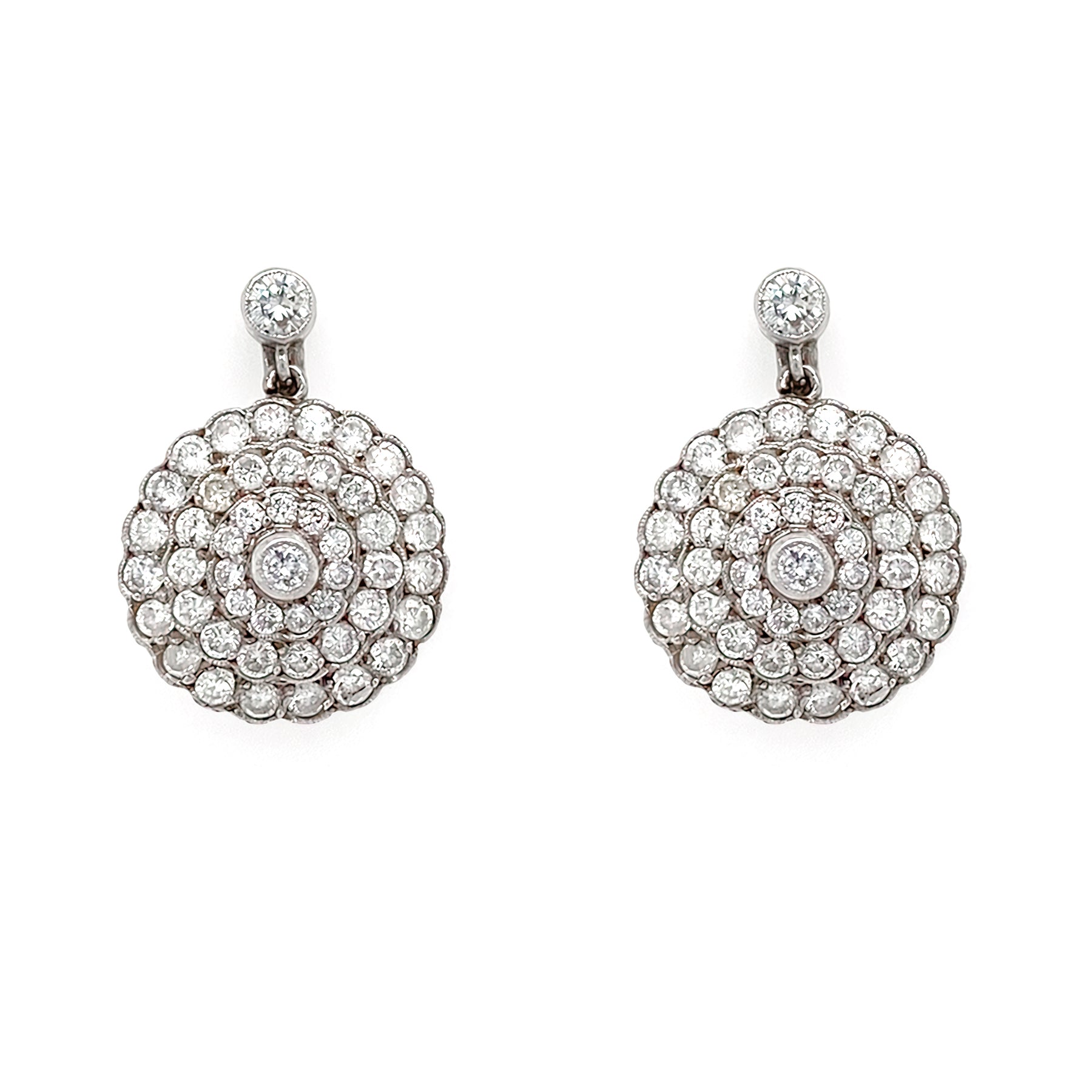 Pair of Estate Platinum diamond earrings on a white background