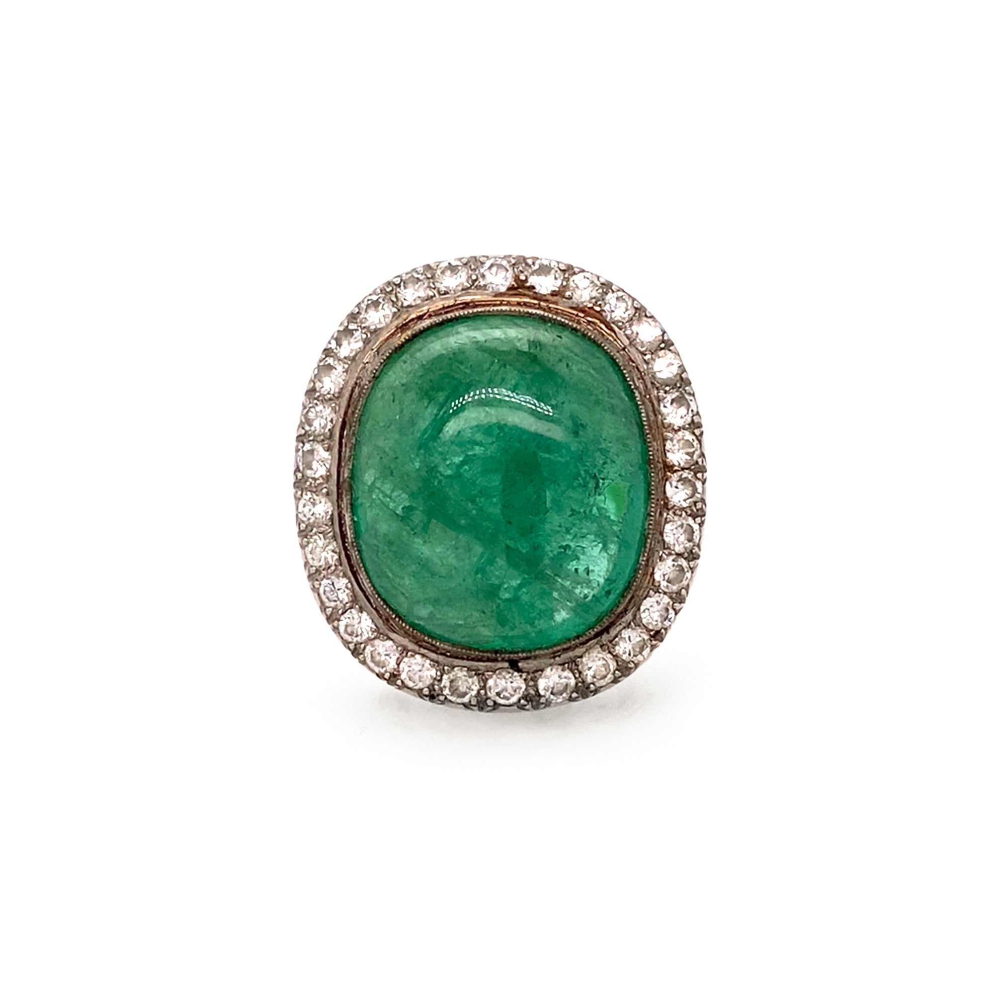 Ring with a large emerald gemstone surrounded by diamonds