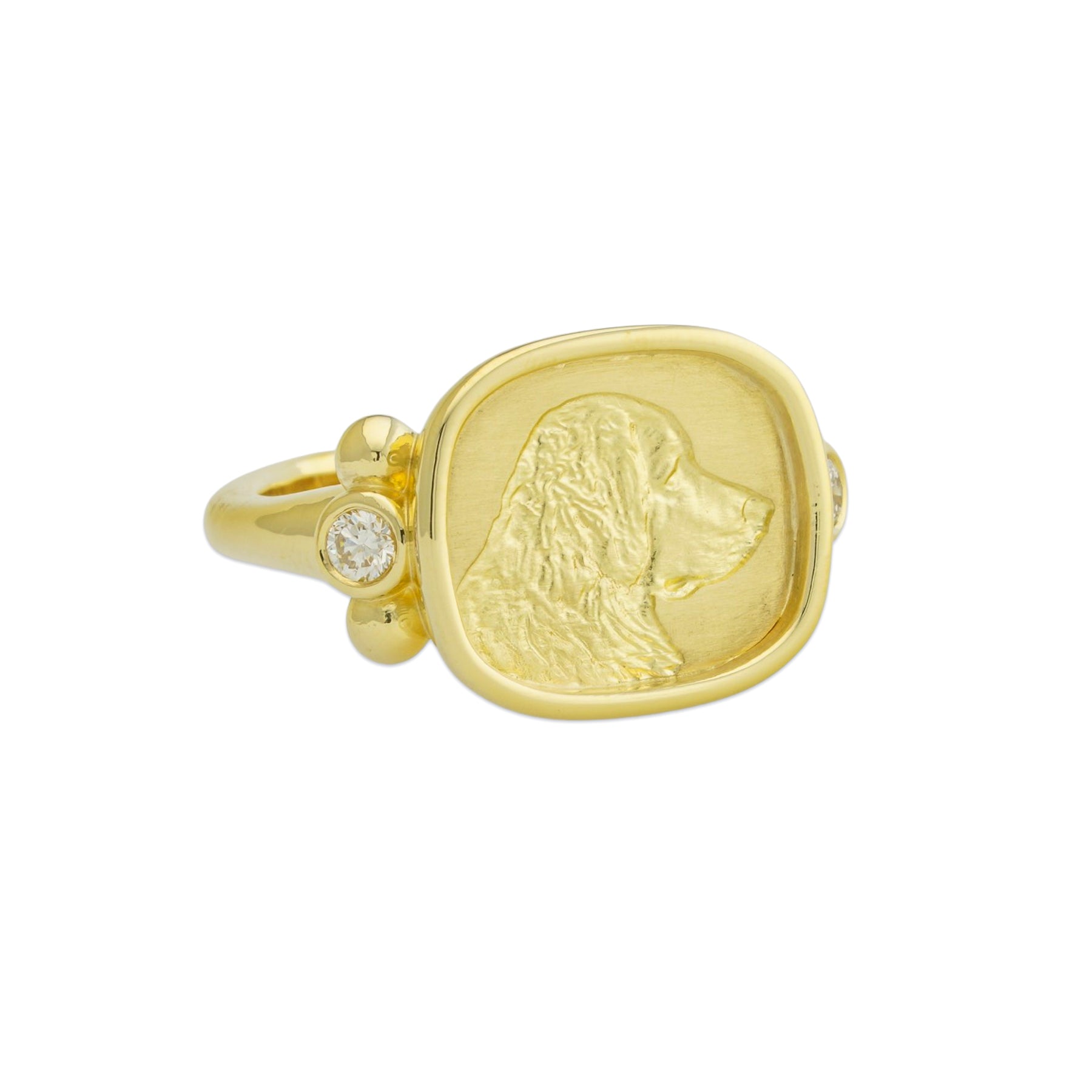 18K Gold ring with a coin-shaped pendant featuring a profile design on a white background