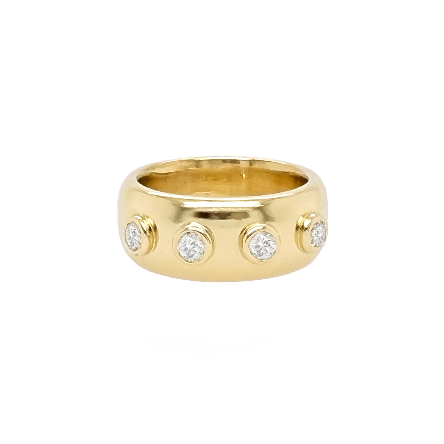 An 18kt yellow gold band ring with four diamonds 