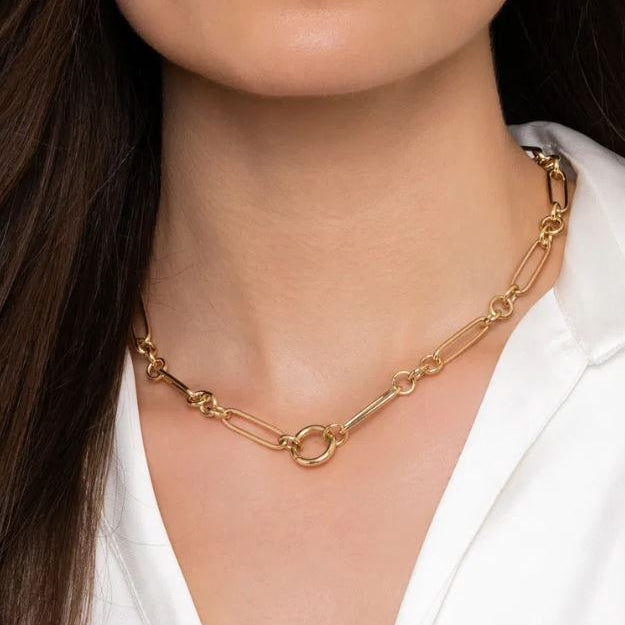 14K Gold chain necklace worn by a woman with a white shirt