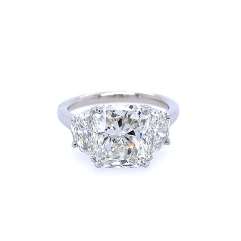 Platinum and radiant cut diamond ring with half moon  side diamonds