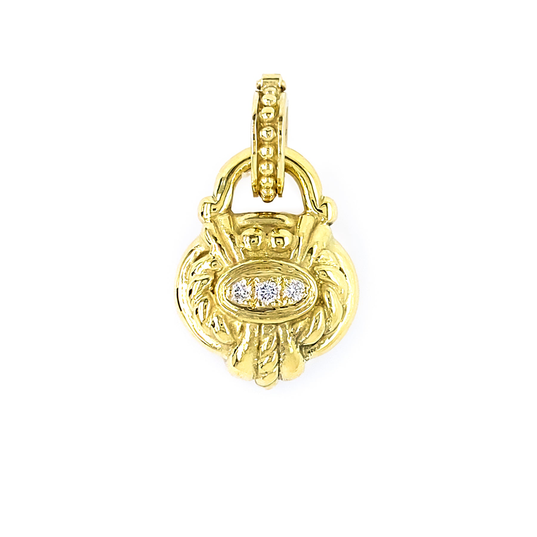 A yellow gold pendant with pave set diamonds, designed in an intricate floral motif style.