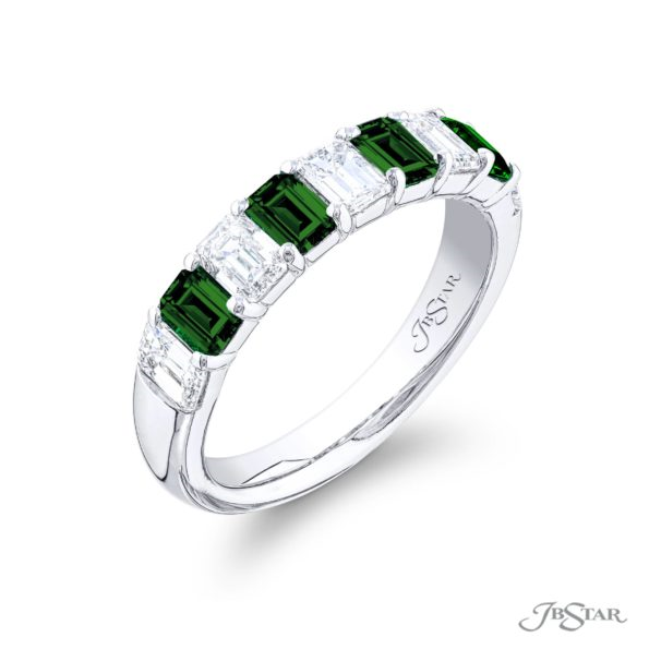 A platinum band featuring emerald and diamond accents, with the JB Star signature on the metal.