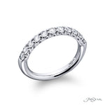 Platinum ring with diamonds on a white background