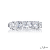 A radiant cut diamond ring with seven stones set in a platinum band.