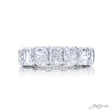 A Radiant cut diamond ring with seven stones set in a platinum band