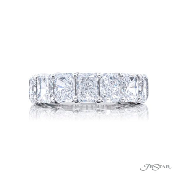 A Radiant cut diamond ring with seven stones set in a platinum band