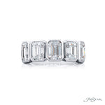 Diamond ring with emerald-cut stones on a white background, featuring the brand 'JB Star'.