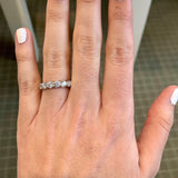 woman's hand wearing a JB Star platinum diamond ring