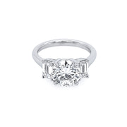 Platinum Round Diamond Ring with Emerald Side Stones