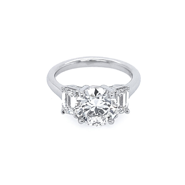 Platinum Round Diamond Ring with Emerald Side Stones