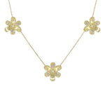 18K Gold necklace with flower-shaped pendants covered with pave diamonds on a white background