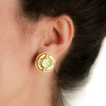 19K Gold earring with a light aqua Venetian glass gemstone worn by a woman