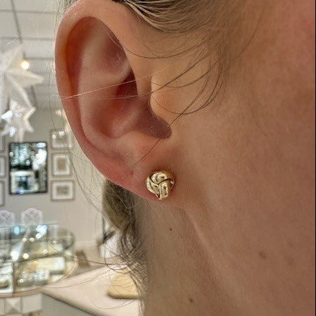 Woman wearing 14K Yellow Gold Love Knot Earrings