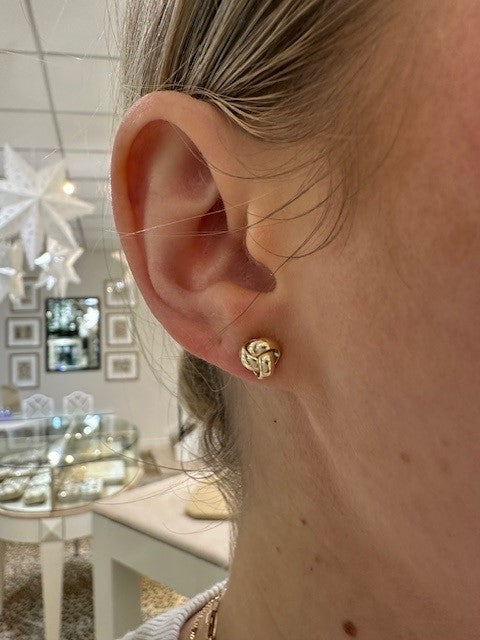 Woman wearing 14K Yellow Gold Love Knot Earrings