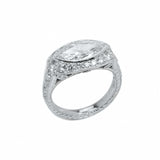 A platinum marquise diamond ring with a halo of smaller diamonds around the top.