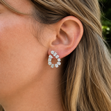white gold and diamond mix shape earrings on the ear