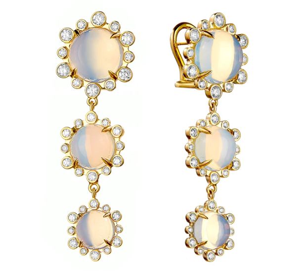 A pair of 18K yellow gold drop earrings featuring moon quartz with smaller diamond accents along the perimeter of the earrings.