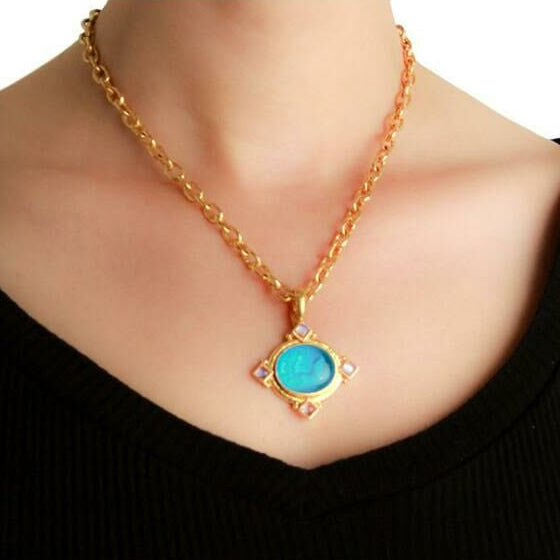 19K Gold necklace with a Nile Cabochon Pendant on model