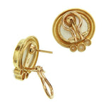 Back view of 19K Gold earrings with intricate design on a white background