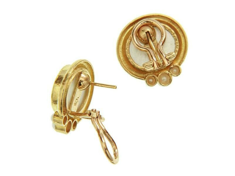 Back view of 19K Gold earrings with intricate design on a white background
