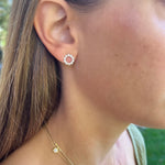 Woman wearing 18K Yellow Gold Open Circle Diamond Studs