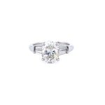 Custom designed Oval Cut Diamond Engagement Ring with Tapered Baguettes in Platinum