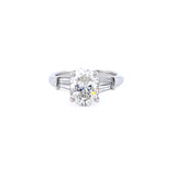 Custom designed Oval Cut Diamond Engagement Ring with Tapered Baguettes in Platinum