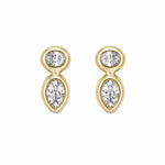 A pair of 14k gold drop stud earrings with a small round clear diamond at the top and a larger pear cut diamond below, shown on a plain white background.