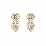 A pair of 14k gold drop stud earrings with a small round clear diamond at the top and a larger pear cut diamond below, shown on a plain white background.
