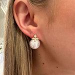 Woman wearing Pearl and diamond earrings