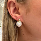 Woman wearing Pearl and diamond earrings
