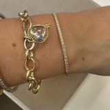 Woman wearing gold bracelets.