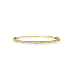 Petite gold bracelet with diamonds designed by Penny Preville