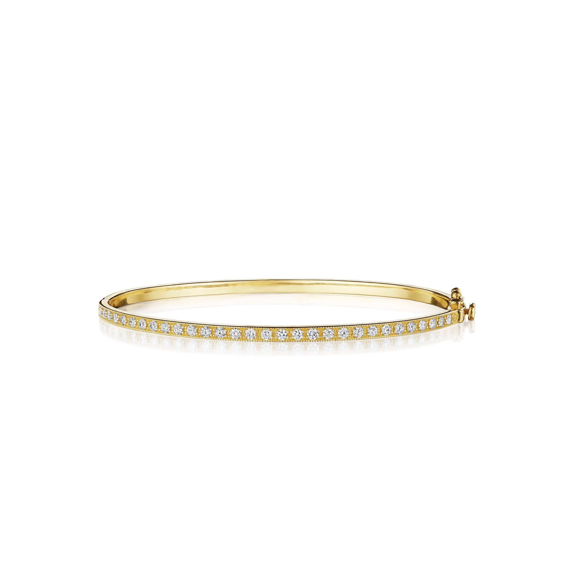 Petite gold bracelet with diamonds designed by Penny Preville